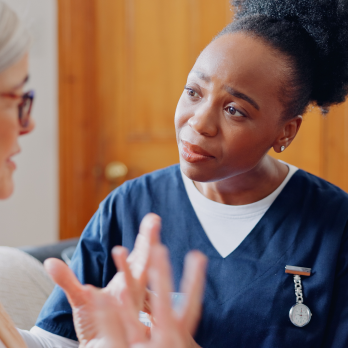 a nurse listening to a patient talk
